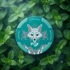 WHITE FOX DOUBLE MINT NICOTINE POUCHES 12MG white and blue can displaying the iconic fox emblem against an icy background.
